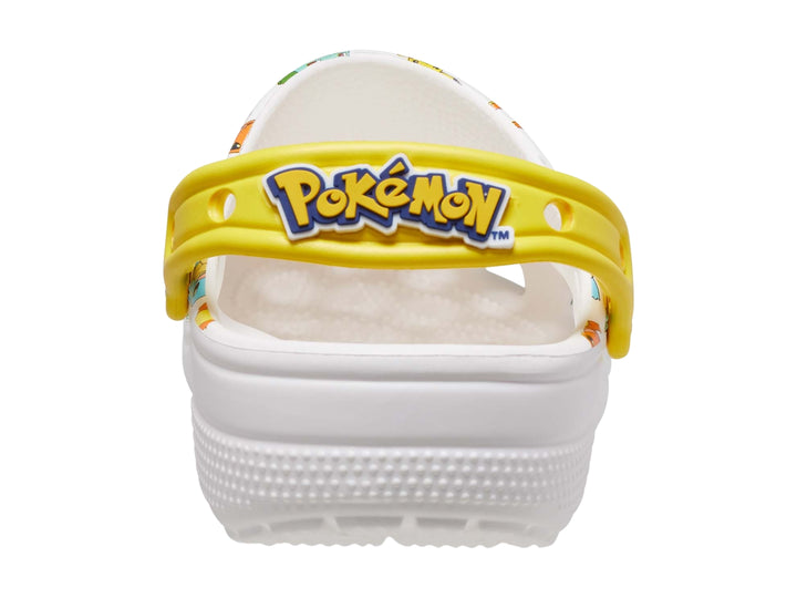 Zuecos Crocs blancos para niño con estampado multicolor de Pokémon y correa amarilla.