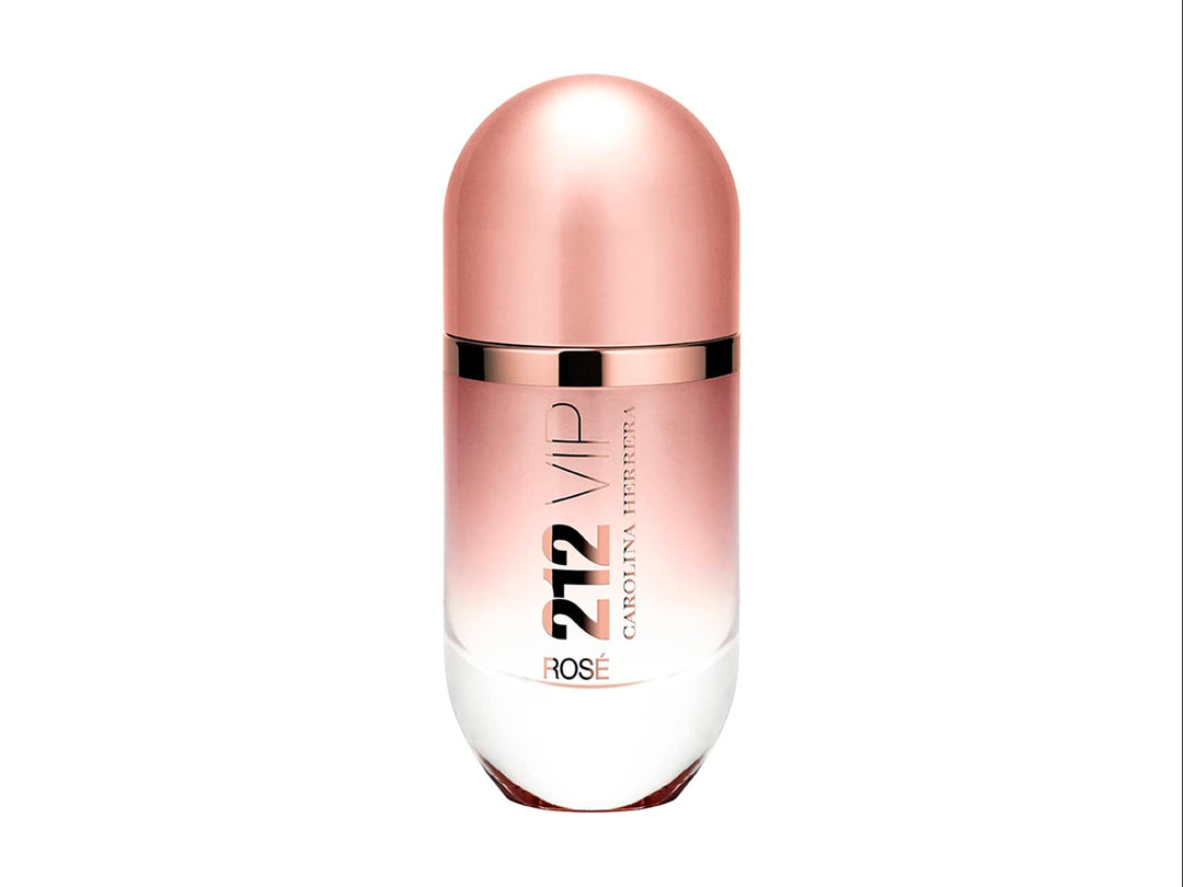 Perfume Carolina Herrera 212 VIP Rosé con su caja en color rosa metálico y botella cilíndrica.