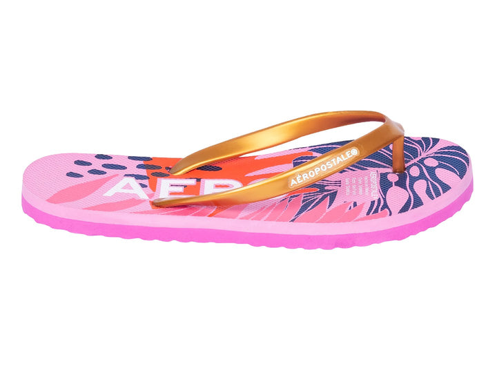 Sandalia de dedo Aeropostale en color rosa claro con tiras doradas y diseño estampado colorido.