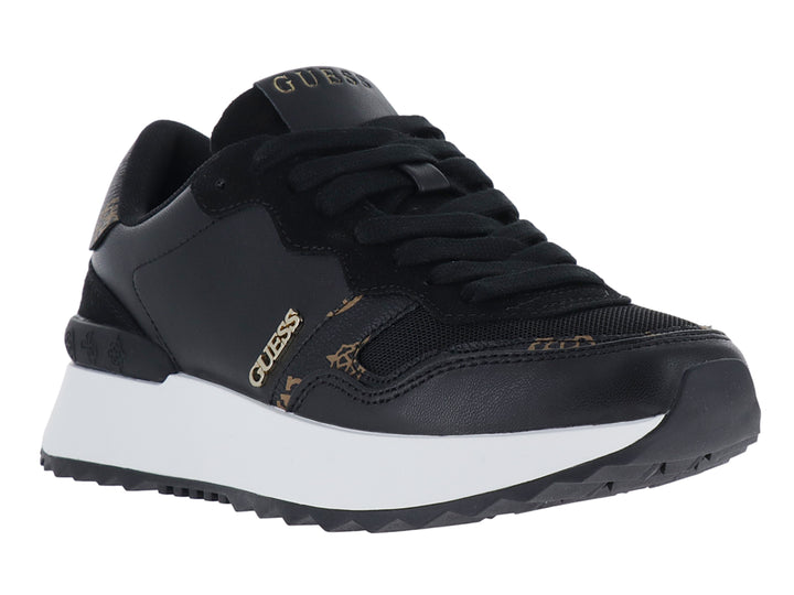 Tenis negros Guess con suela blanca y detalles dorados.