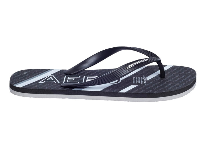 Sandalias negras y blancas de la marca Aeropostale con diseño de rayas y letras repetidas en la plantilla.