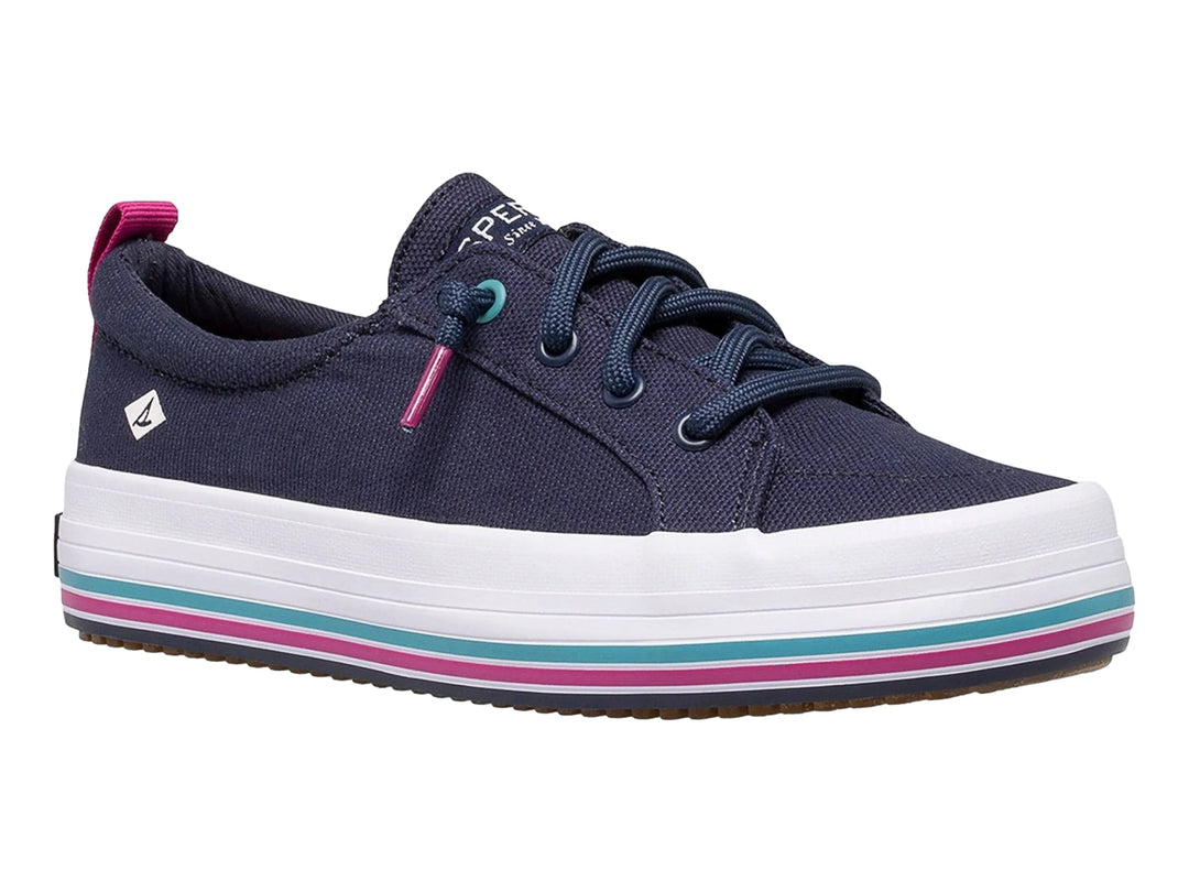 Zapato casual Sperry azul marino con suela blanca y detalles en rosa y turquesa.