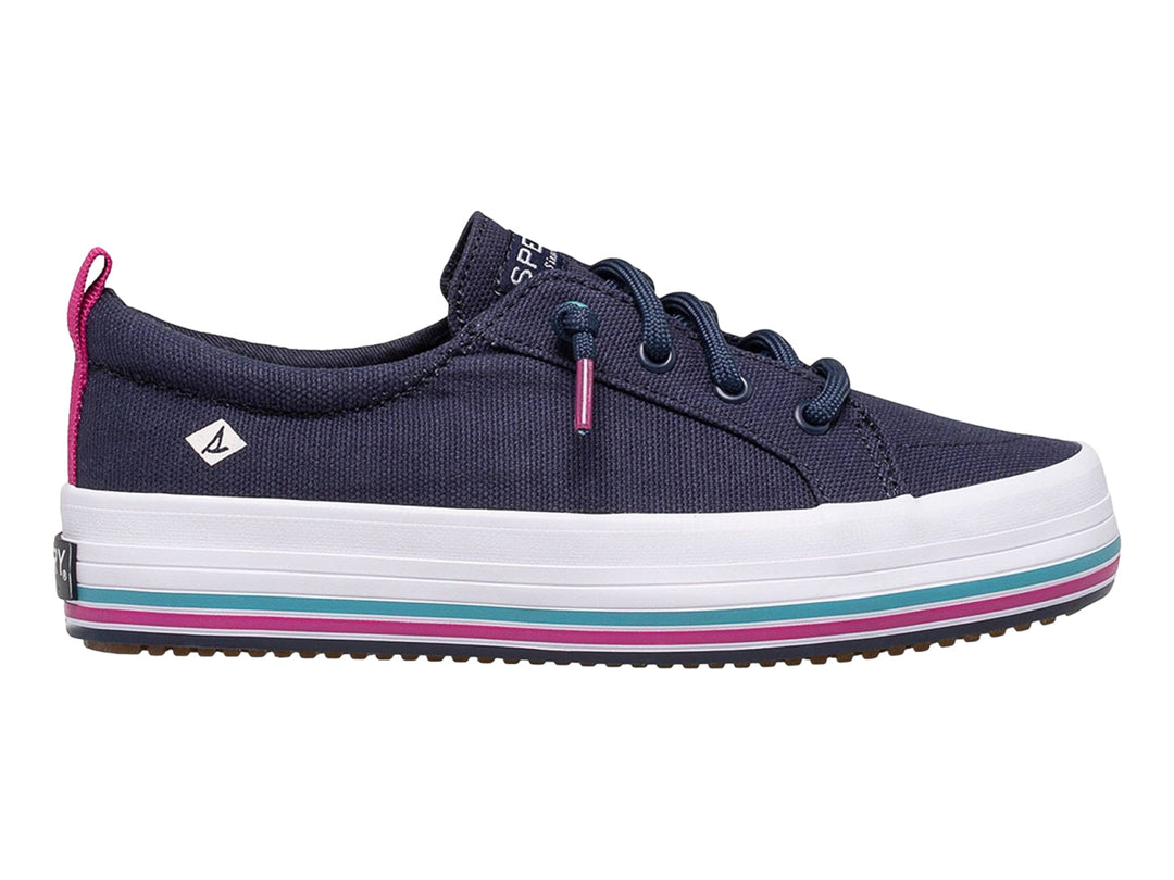 Zapato casual Sperry azul marino con suela blanca y detalles en rosa y turquesa.