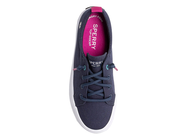 Zapato casual Sperry azul marino con suela blanca y detalles en rosa y turquesa.