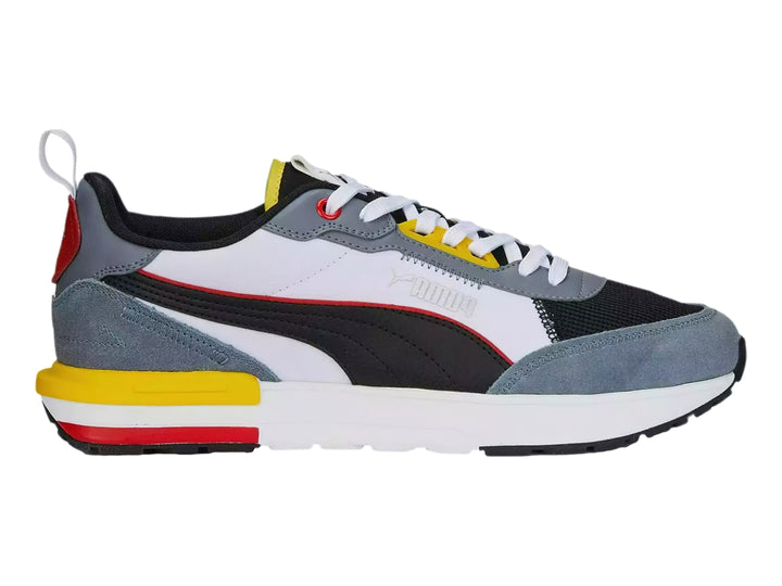Tenis deportivos Puma R22 en colores gris, blanco, negro, amarillo y rojo, vista lateral.