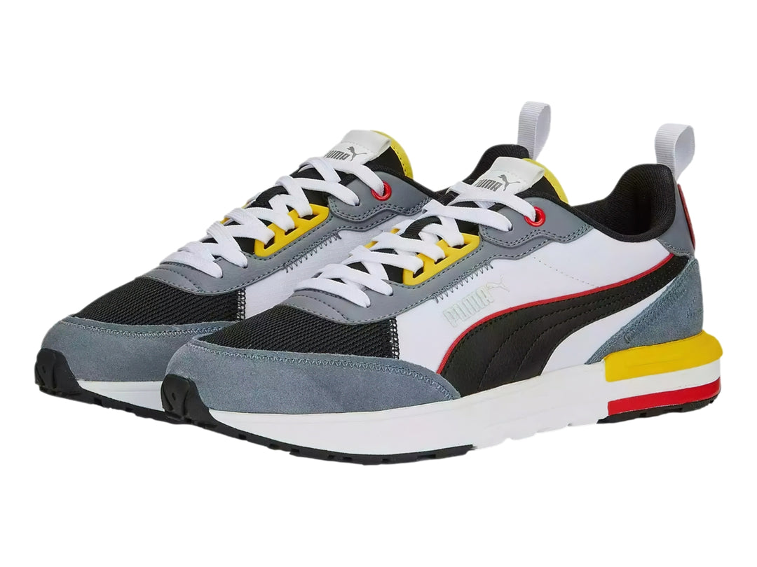Tenis deportivos Puma R22 en colores gris, blanco, negro, amarillo y rojo, vista lateral.