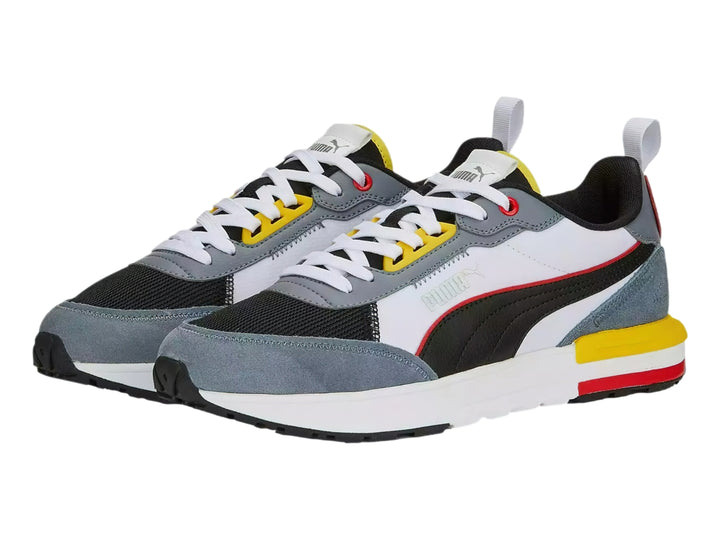 Tenis deportivos Puma R22 en colores gris, blanco, negro, amarillo y rojo, vista lateral.