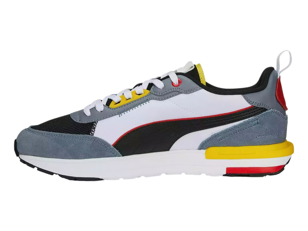 Tenis deportivos Puma R22 en colores gris, blanco, negro, amarillo y rojo, vista lateral.