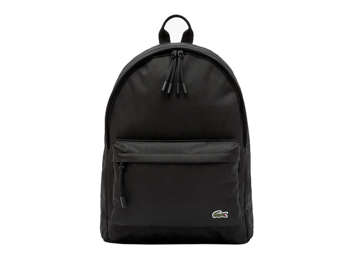 Mochila escolar Lacoste color marino con bolsillo frontal y logotipo del cocodrilo.
