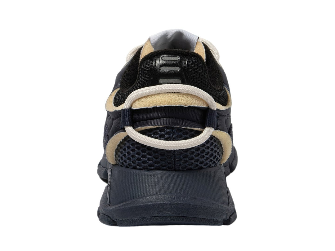 Tenis deportivos Lacoste color azul marino y negro con detalles en beige y suela robusta.