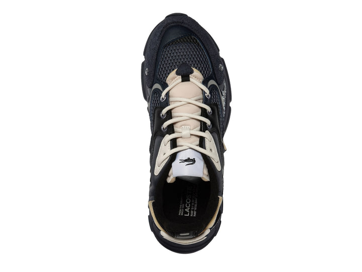 Tenis deportivos Lacoste color azul marino y negro con detalles en beige y suela robusta.