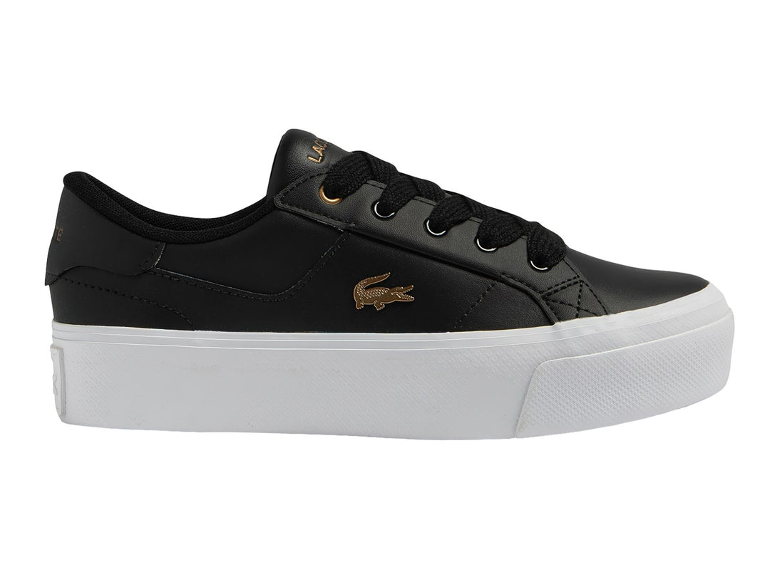 Tenis Lacoste Ziane Platform en color negro con suela blanca ancha y logo dorado lateral.