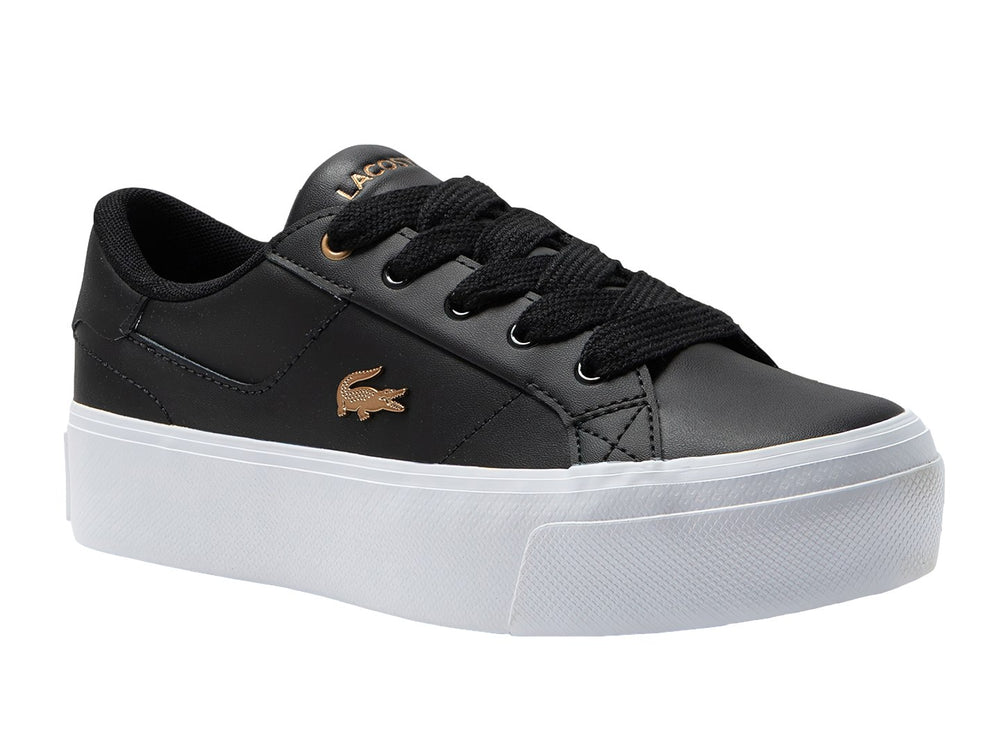 Tenis Lacoste Ziane Platform en color negro con suela blanca ancha y logo dorado lateral.