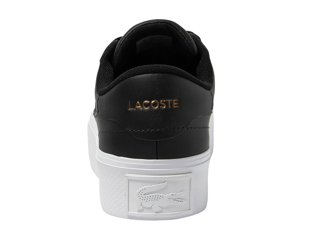 Tenis Lacoste Ziane Platform en color negro con suela blanca ancha y logo dorado lateral.