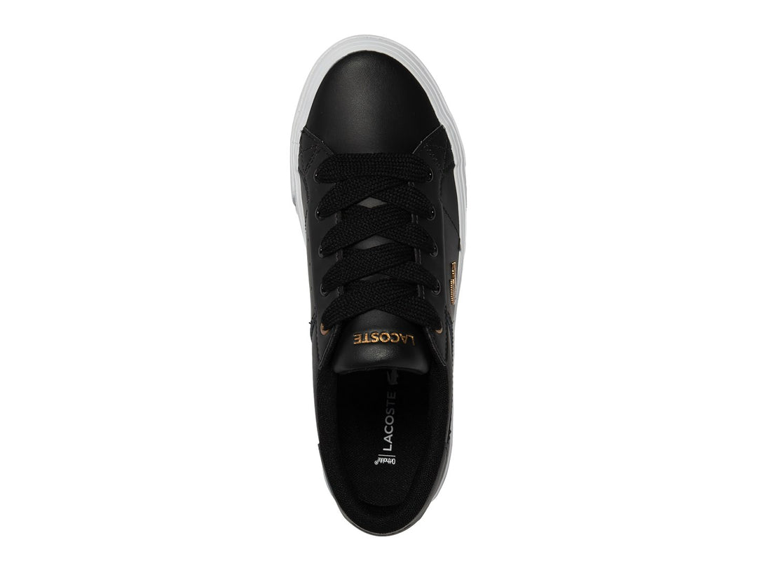 Tenis Lacoste Ziane Platform en color negro con suela blanca ancha y logo dorado lateral.