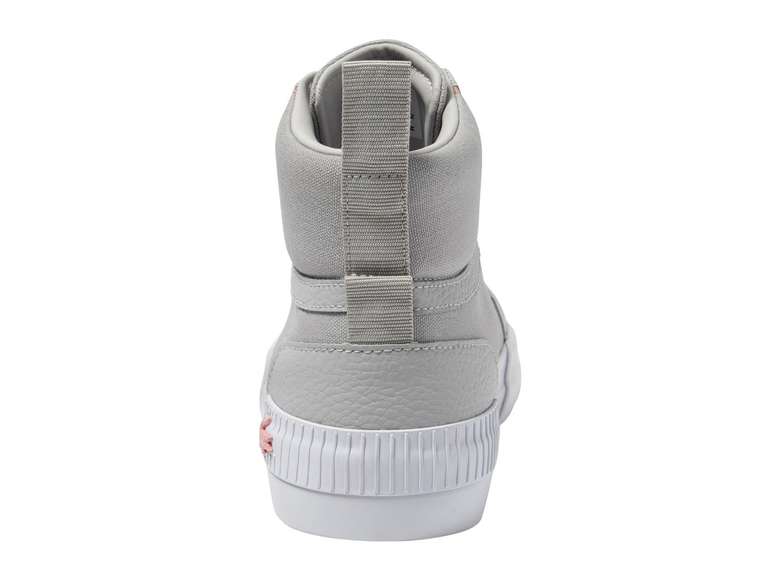 Tenis Lacoste de corte medio en color gris con detalles rosas y suela blanca.