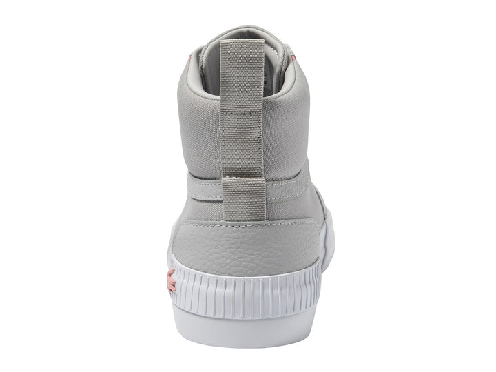 Tenis Lacoste de corte medio en color gris con detalles rosas y suela blanca.