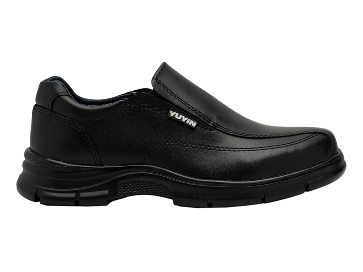 Zapato negro estilo slip-on para niño, material sintético y suela gruesa.