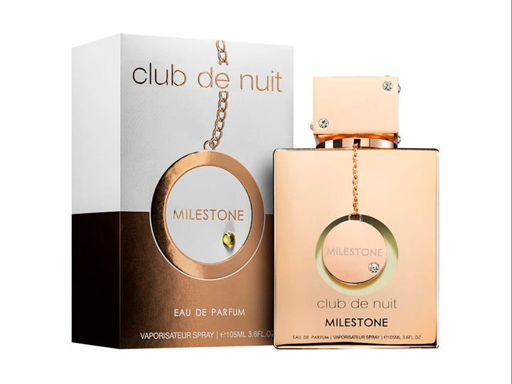 Perfume Armaf Club de Nuit Milestone para mujer en botella dorada con su caja blanca y dorada.