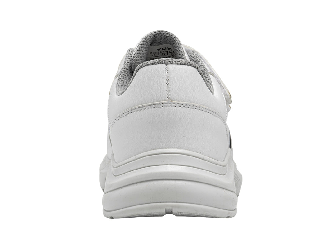 Tenis escolares blancos para niños con cierres de velcro y suela blanca.