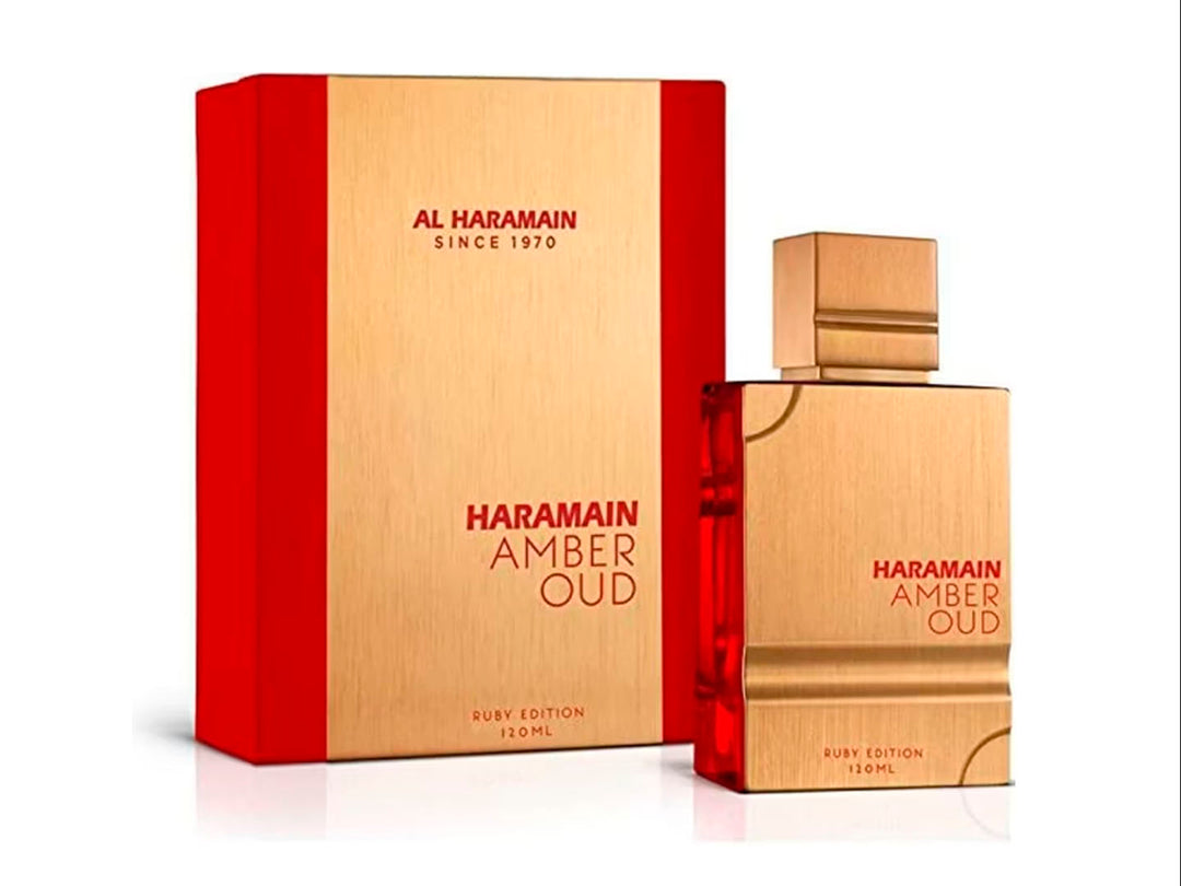 Perfume Al Haramain Amber Oud Ruby Edition en frasco y caja de color dorado con detalles rojos.