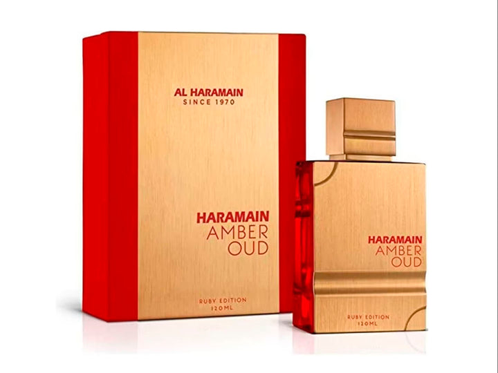Perfume Al Haramain Amber Oud Ruby Edition en frasco y caja de color dorado con detalles rojos.