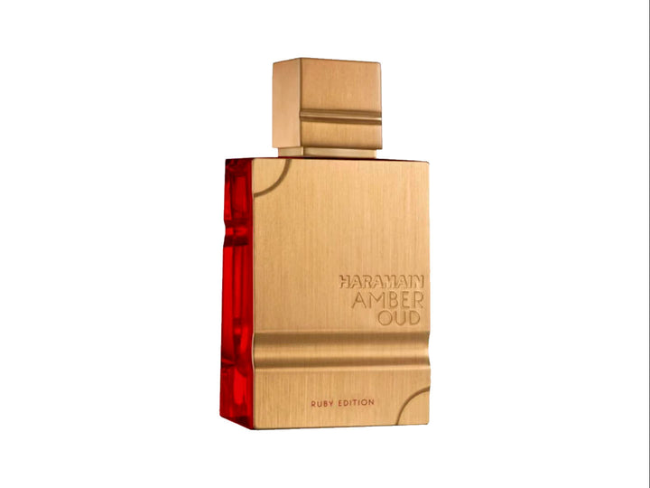 Perfume Al Haramain Amber Oud Ruby Edition en frasco y caja de color dorado con detalles rojos.