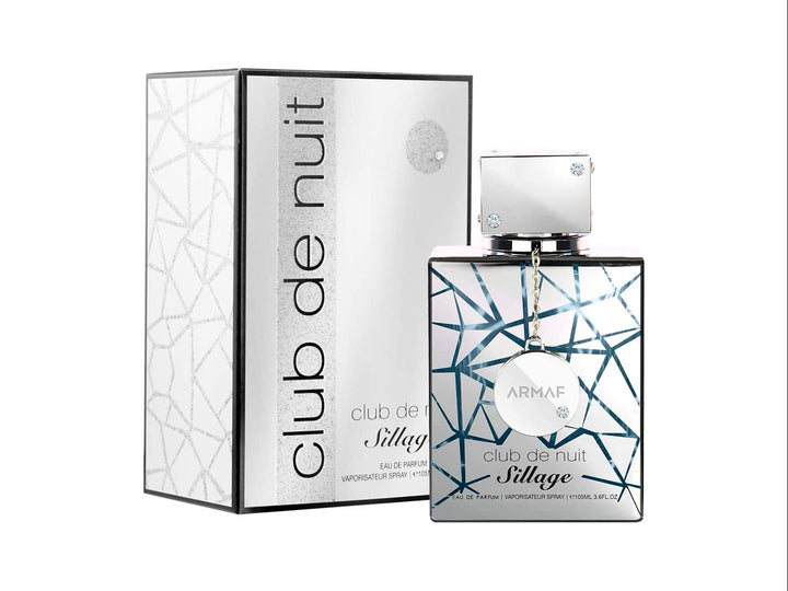 Perfume Armaf Club de Nuit Sillage de 105 ml con frasco y caja en color blanco y plata con diseño geométrico.