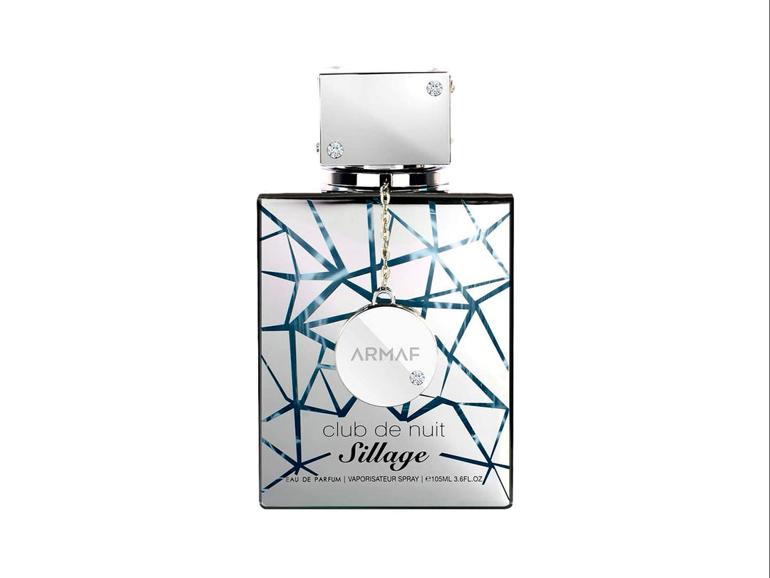 Perfume Armaf Club de Nuit Sillage de 105 ml con frasco y caja en color blanco y plata con diseño geométrico.