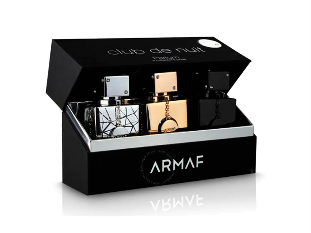 Set de 3 fragancias Club de Nuit de Armaf en frascos dorado, plateado y negro con su caja protectora.
