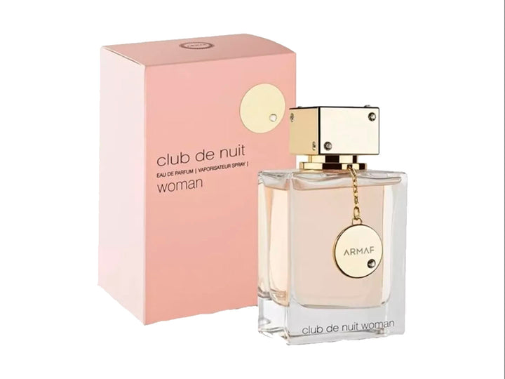 Perfume Armaf Club de Nuit Woman en botella de vidrio transparente con tapa dorada y su caja color rosa.