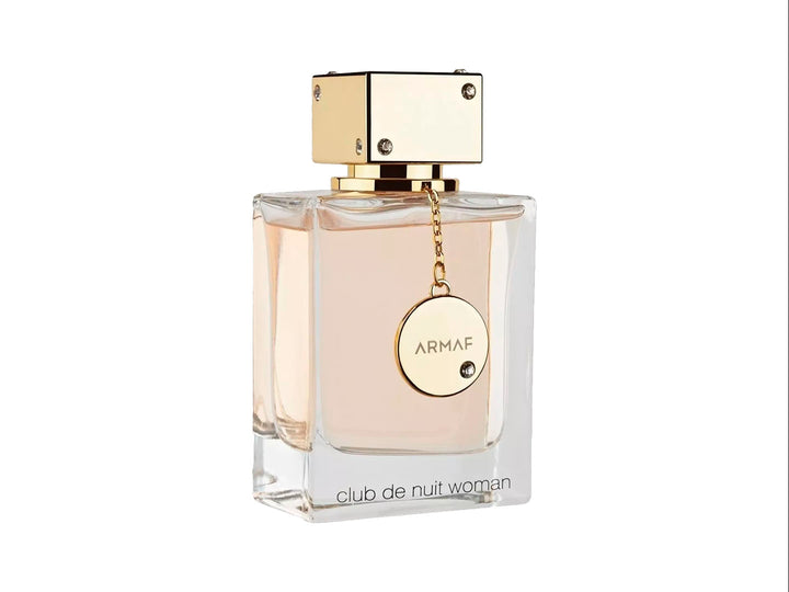 Perfume Armaf Club de Nuit Woman en botella de vidrio transparente con tapa dorada y su caja color rosa.