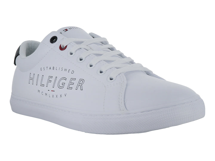 Tenis Tommy Hilfiger color blanco con detalles en azul marino y letras grises en el costado.