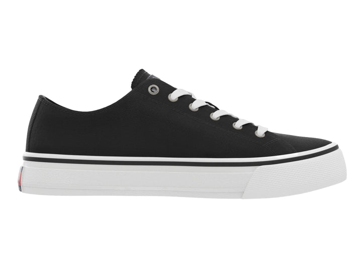Tenis Tommy Hilfiger de lona color negro con suela y agujetas blancas, estilo skate.