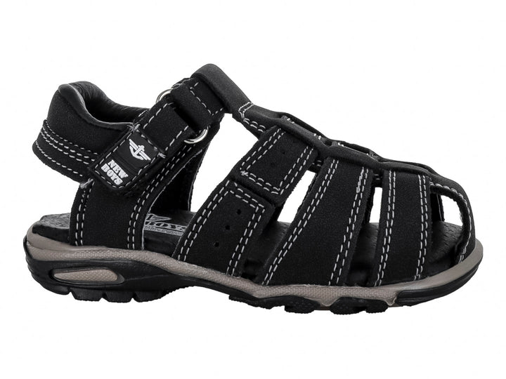 Sandalias negras cerradas para niño con correas ajustables de velcro y suela gris.