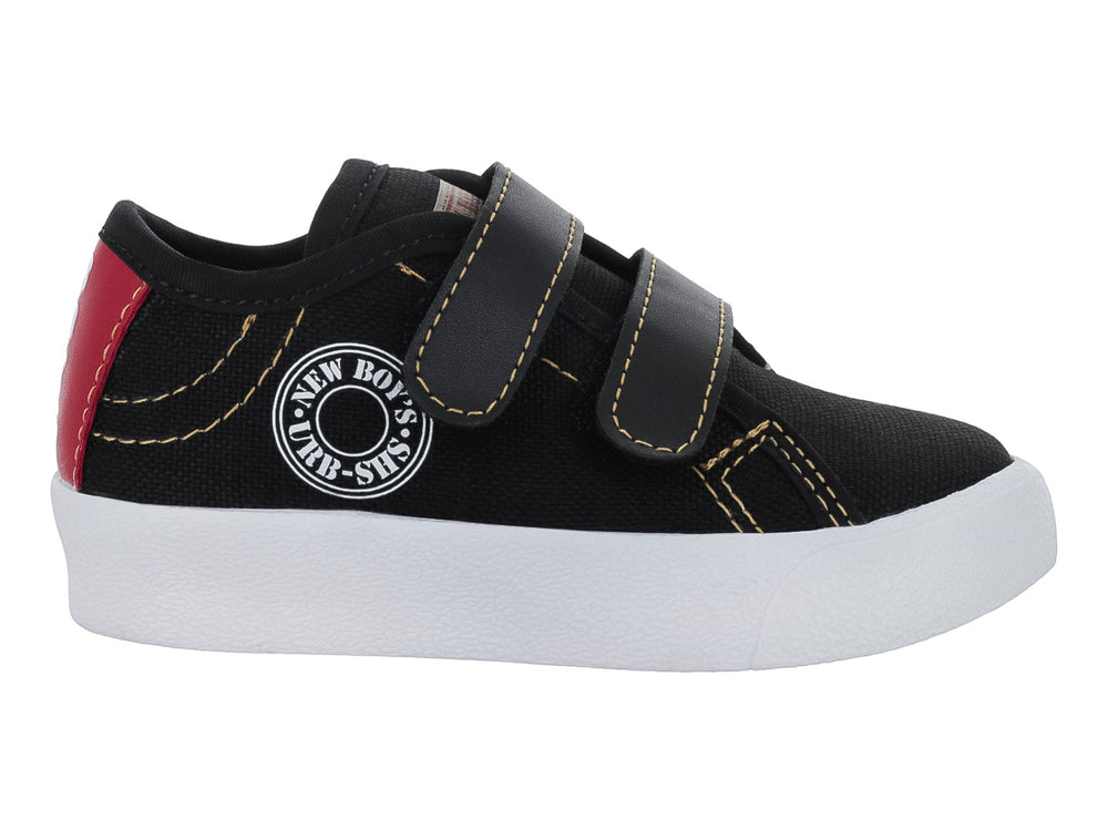 Zapato casual negro para niño con suela blanca y cierre de dos correas de velcro.