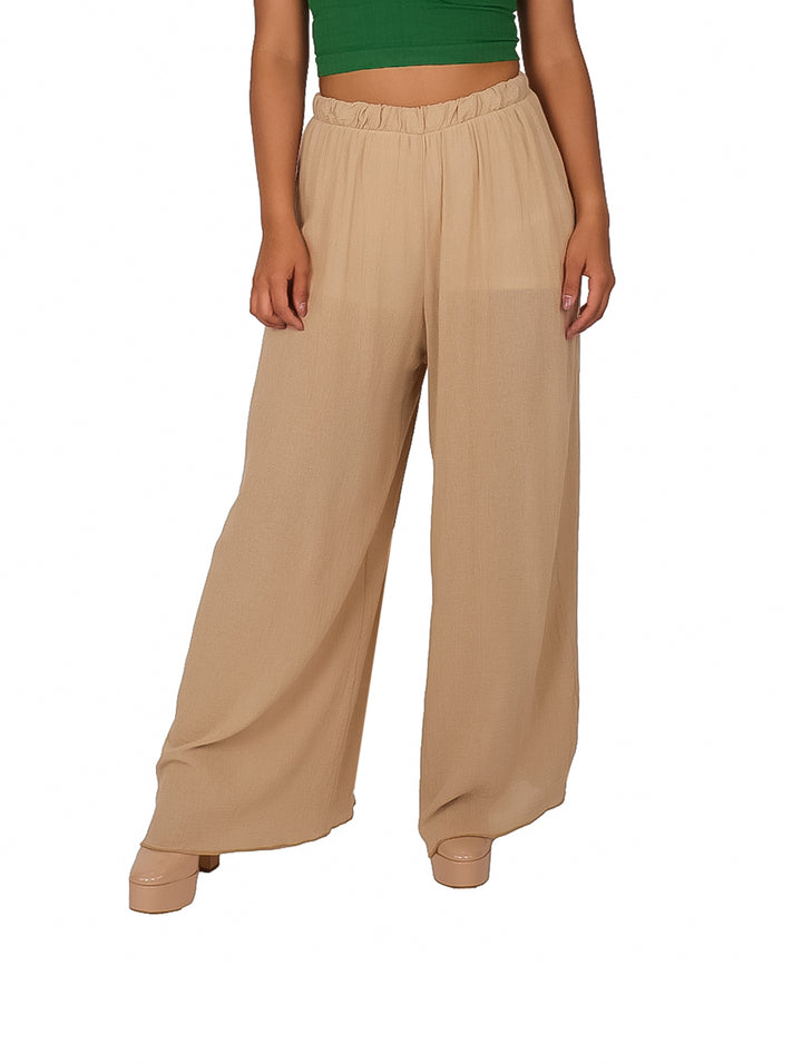 Pantalón de manta color arena para mujer, de corte ancho y cintura elástica.