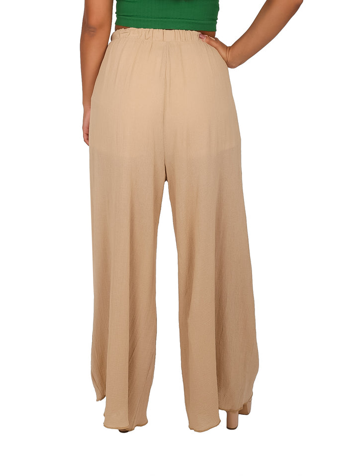 Pantalón de manta color arena para mujer, de corte ancho y cintura elástica.