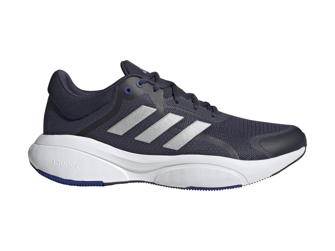 Tenis Adidas Response en color azul marino con franjas plateadas y suela blanca.