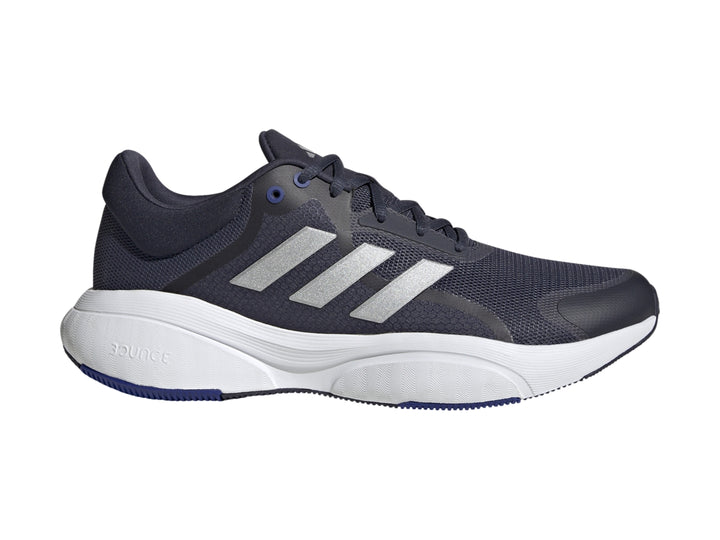 Tenis Adidas Response en color azul marino con franjas plateadas y suela blanca.