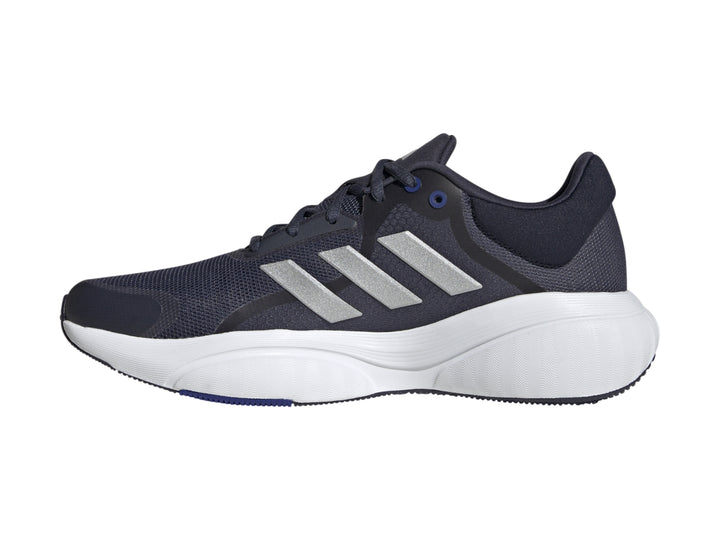 Tenis Adidas Response en color azul marino con franjas plateadas y suela blanca.