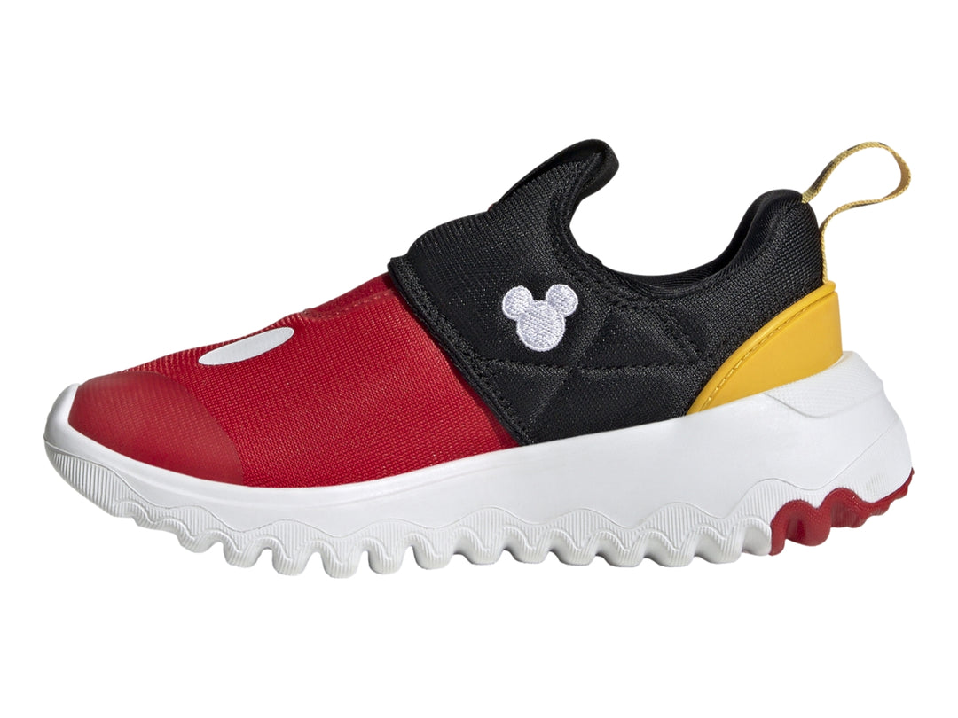 Zapato deportivo Adidas infantil en colores rojo, negro y amarillo con suela blanca ondulada.