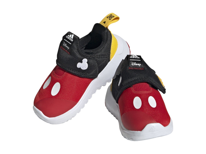 Tenis infantiles Adidas en colores rojo, negro y amarillo con suela blanca dentada.