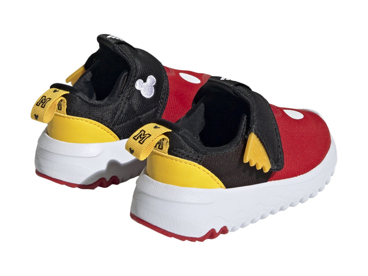 Tenis infantiles Adidas en colores rojo, negro y amarillo con suela blanca dentada.