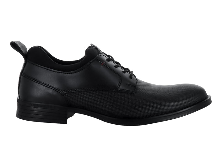 Zapato formal de piel color negro con cordones y detalle texturizado lateral.