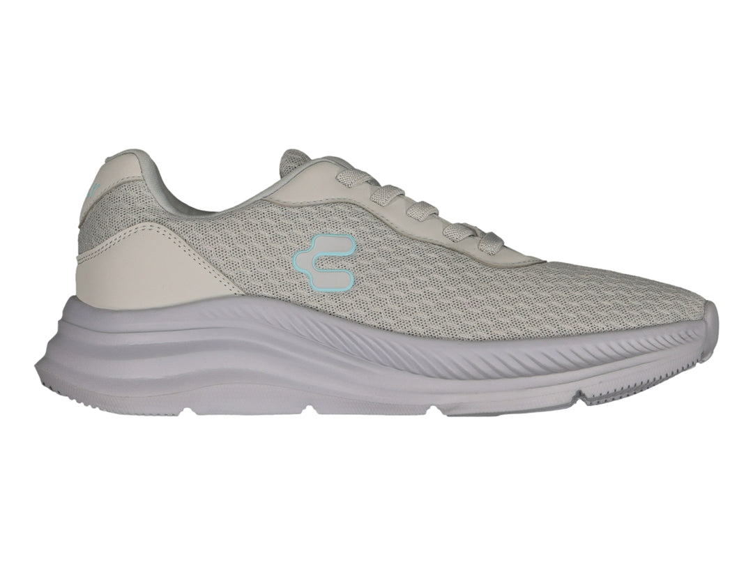 Tenis deportivos Charly color gris con tejido de malla y suela gruesa.