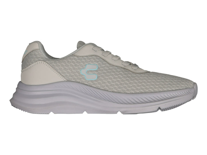 Tenis deportivos Charly color gris con tejido de malla y suela gruesa.