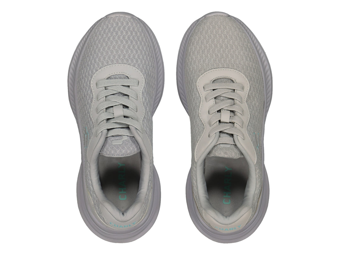 Tenis deportivos Charly color gris con tejido de malla y suela gruesa.