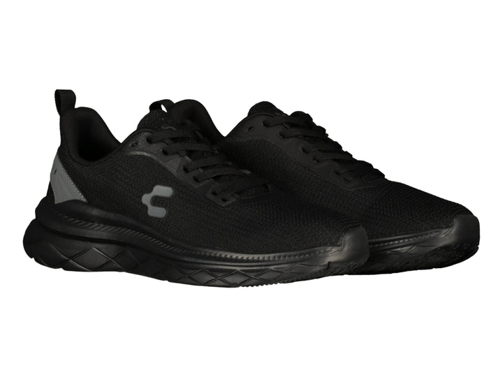 Tenis deportivos Charly color negro con detalles en gris y suela robusta texturizada.