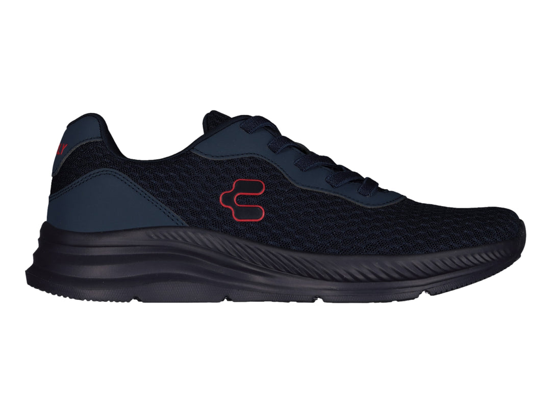 Tenis deportivos Charly en color azul marino con logotipo rojo lateral y suela a juego.